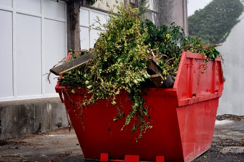 Workers clearing construction waste from a building site