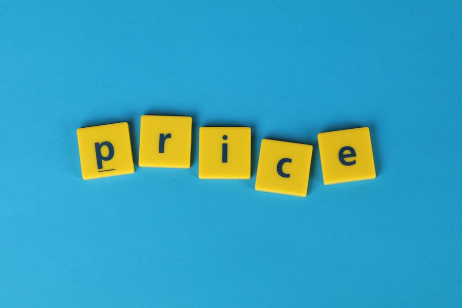 A close-up image of five yellow plastic letter tiles arranged horizontally on a solid light blue background. Each tile features a single lowercase letter in dark blue, spelling out the word 'price'. T